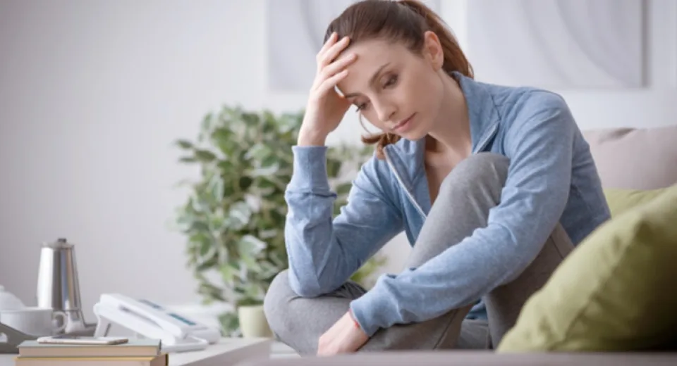 woman sitting thoughtfully